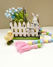 Load image into Gallery viewer, Easter basket laser cut file with cute bunny hopping the fence. Includes 2 size basket files